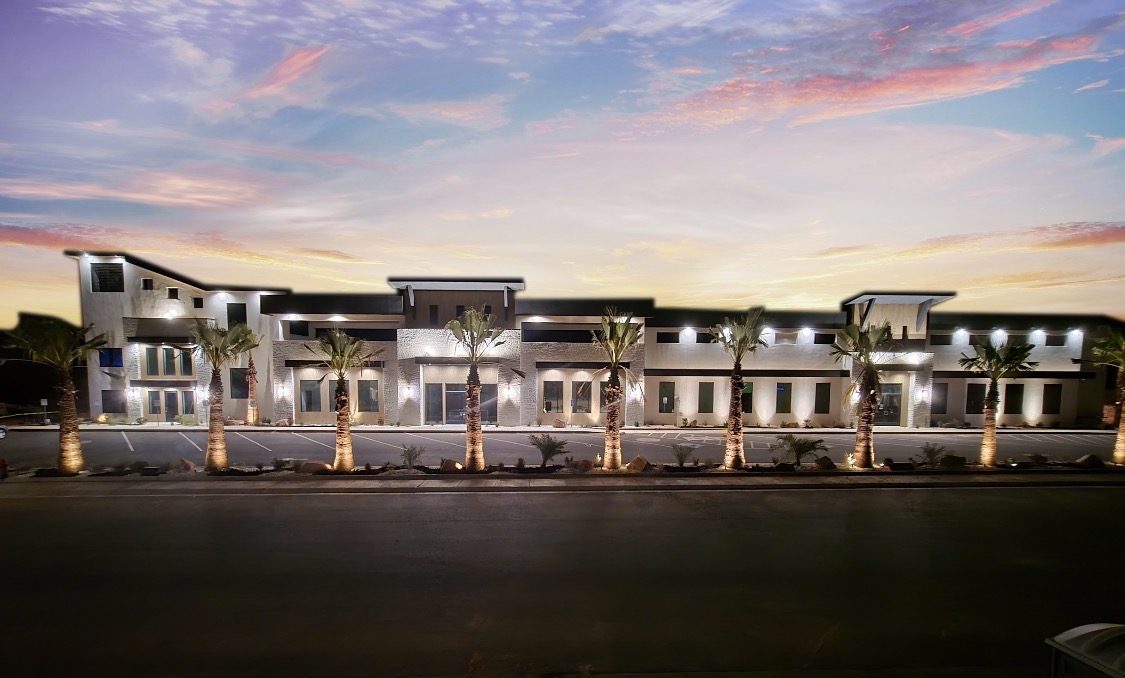 Pecan Valley Resort exterior at dusk